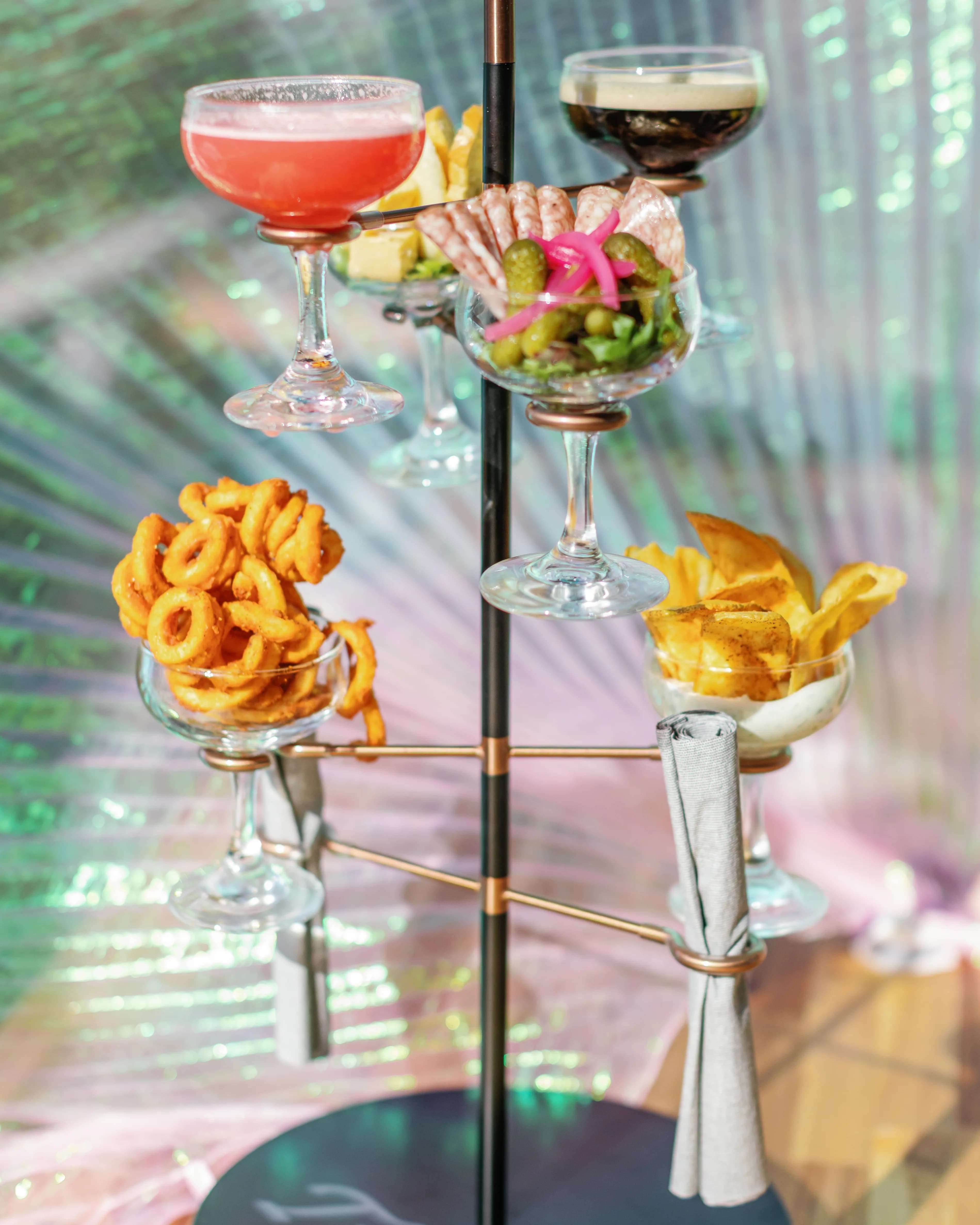 Multi-tiered cocktail snack tower with shareable rooftop appetizers